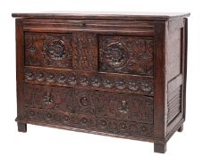 A carved oak mule chest,