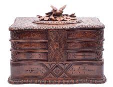 A 'Black Forest' stained lindenwood sewing workbox,