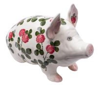 A large Plictha pottery pig, painted by Joseph Nekola with flowering clover,