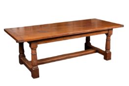 A substantial oak dining table in 17th century taste,