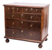 A Queen Anne burr walnut, banded and line-inlaid chest of drawers,