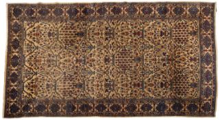 A Tabriz carpet, the ivory field with an all over design of urns of flowers and leaves,