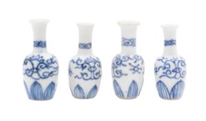 Vung Tau cargo four miniature porcelain 'Dolls House' vases painted with stylised scrolls above a
