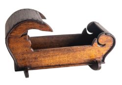 A stained walnut model of a crib in early 18th century taste,
