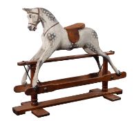 A large Victorian painted wood rocking horse,