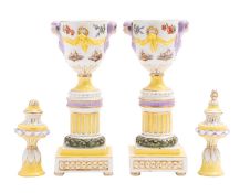 A pair of Berlin yellow-ground cassolettes, late 19th century in the form of classical urns,