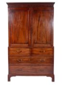 A George III Irish mahogany and inlaid linen press bordered with boxwood lines,