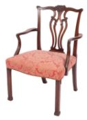 A George III mahogany library elbow chair,