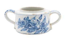 A Dutch Delft two handled jar painted in blue with flowers, 21cm wide, [glue repairs].