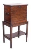 A George III mahogany cellaret on stand, late 18th century; of rectangular form,