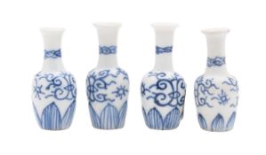 Vung Tau cargo four miniature porcelain 'Dolls House' vases painted with stylised scrolls above a