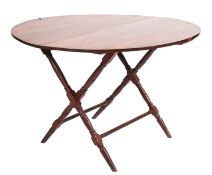 A mahogany coaching or shooting table, late 19th/early 20th century, with hinged circular top,