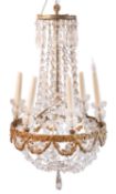 A gilt metal and cut glass six-light chandelier in Regency taste,