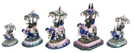 A group of five Indian enamelled white metal models of elephants,