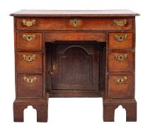 A George II oak and crossbanded kneehole desk ,