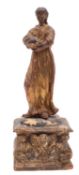 A Continental carved, painted and giltwood model of a female saint,