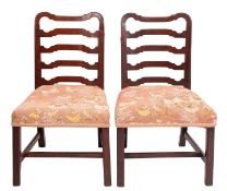 A pair of George III mahogany side chairs,