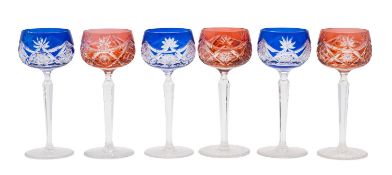 Six cut hock glasses comprising three ruby flashed and three blue flashed examples on clear faceted