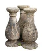 A set of three stone composition balusters,