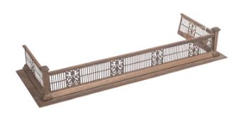A Victorian brass fender, in Neoclassical taste,
