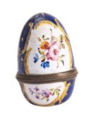 A George III Bilston enamelled nutmeg grater in the form of an egg,