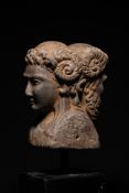 A ROMAN MARBLE JANIFORM BUST, CIRCA 2ND CENTURY A.D.