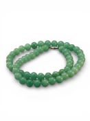 A Pekin Glass Bead Necklace imitating Jadeite, metal clasp
