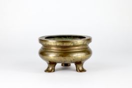 A Bronze Tripod Censer, liding, six character mark of Xuande, 18th century