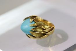 A Turquoise set 18ct gold ring . French gold marks and makers marks on exterior of shank. Signed wit
