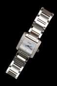 A Cartier Wristwatch in steel with after market set Diamonds and square Dial