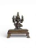 An lndian Bronze of a seated Durga, 16/17th century