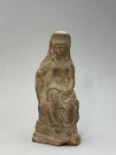 A Roman Pottery seated Goddess, c.3rd century AD