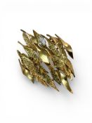Alan Gard: A Brooch set with a Marquise Diamond, signed AMG on the pin, marked 18ct, with London hal