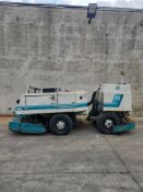 Tennant 550 heavy-duty industrial riding floor scrubber. Hours: 8,504