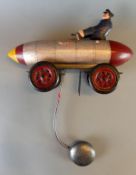 Kinderspielzeug, Blech, Holz, im Design eines Raketenwagens,
