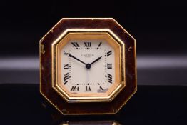 A Fine Cartier Gold Gilt and Burgundy Enamel Octagonal Travel Alarm Clock, Circa 1980