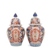 A pair of late Meiji period (1868-1912) Japanese Imari porcelain vases and covers (2)