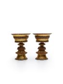 A PAIR OF GILT COPPER ALLOY OIL LAMPS Tibet, 20th century (2)