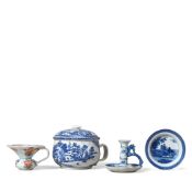 A BLUE AND WHITE CANDLESTICK, A CHAMBER POT, A CHINESE IMARI HANDLED SPITTOON AND A BLUE AND WHI...