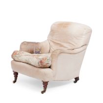 A late Victorian upholstered easy armchair made by Howard & Sons Late 19th century