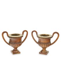 A pair of George III mahogany and silver gilt wine coolers The silver gilt rims, George Fenwick...