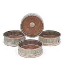 A set of George III silver wine coasters By Thomas & Joseph Guest & Joseph Craddock, London, 180...