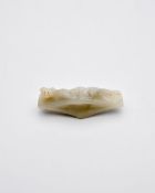 A PALE CELADON JADE 'CHI DRAGON' SWORD GUARD Han Dynasty style