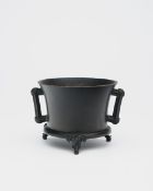 A BRONZE TRIPOD INCENSE BURNER WITH SCROLL HANDLES AND ELEPHANT-HEAD FEET Xuande six-character m...