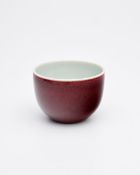 A SANG-DE-BOEUF-GLAZED CUP 20th century