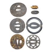 A Group of Eight Metal and Iron Tsuba and Accessories Japan, late Edo period (1615-1868) or Meij...