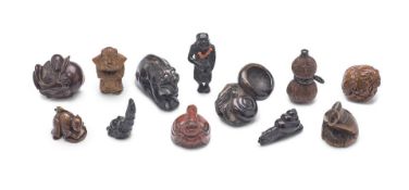 A Group of Twelve Mostly Wood Netsuke Japan, Edo period (1615-1868) or Meiji era (1868-1912), 19...