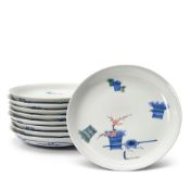 A Set of Nine Nabeshima 'Wheat and Prunus' Plates Japan, Edo period (1615-1868) or Meiji era (18...