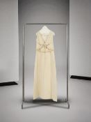 Christian Dior Boutique, collection Couture, circa 1960. Robe du soir en ziberline ivoire. Christ...