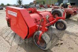 Grimme potato and bed topper with conveyor, side discharge.